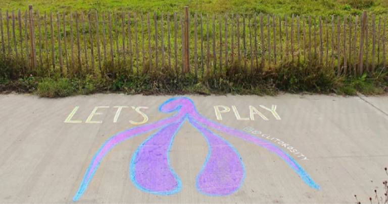 woman-creating-clitoris-street-art-0